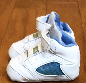 white jordans with blue bottom