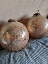 Pair of large gold decorative glass globes