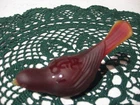 Fenton red bird with Let It Snow carved on top and a snowflake on the back