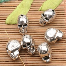 Cuentas espaciadoras cabeza calavera tono plata tibetano 4 piezas h0658