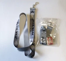 2  Star Wars Disneyland Galaxy Edge Lanyards, one used, one sealed with Pin