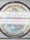 1883-O PCGS MS64 Morgan Dollar w/ Luminous Opalescent Rainbow End-Of-Roll Toning