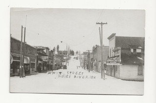 1923 PRIEST RIVER ID RPPC STREET SCENE BONNER CAFE POOL HALL REX THEATER