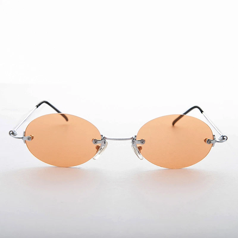 Gafas de sol vintage de los años 90 con lentes ovaladas sin montura naranja - Piper Foto 2 de 3