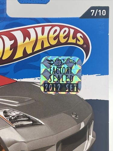Nissan 350Z 2012 Hot Wheels sellado de fábrica plateado como nuevo estuche protector 1/64 - Imagen 4 de 10