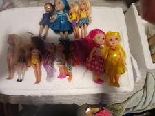 LOT OF 12 SMALL DOLLS THERE IS A NICE VARITY