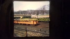20709 35MM Train Slide ENGINES CARS STATIONS BRIDGE TRAIN ON TRACK BEHIND FENCE
