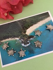 Silver plate turtle beads.  Total of 6.  Design on both sides.  