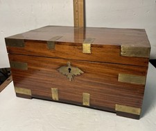 This is an antique brass-bound campaign writing slope, or lap desk