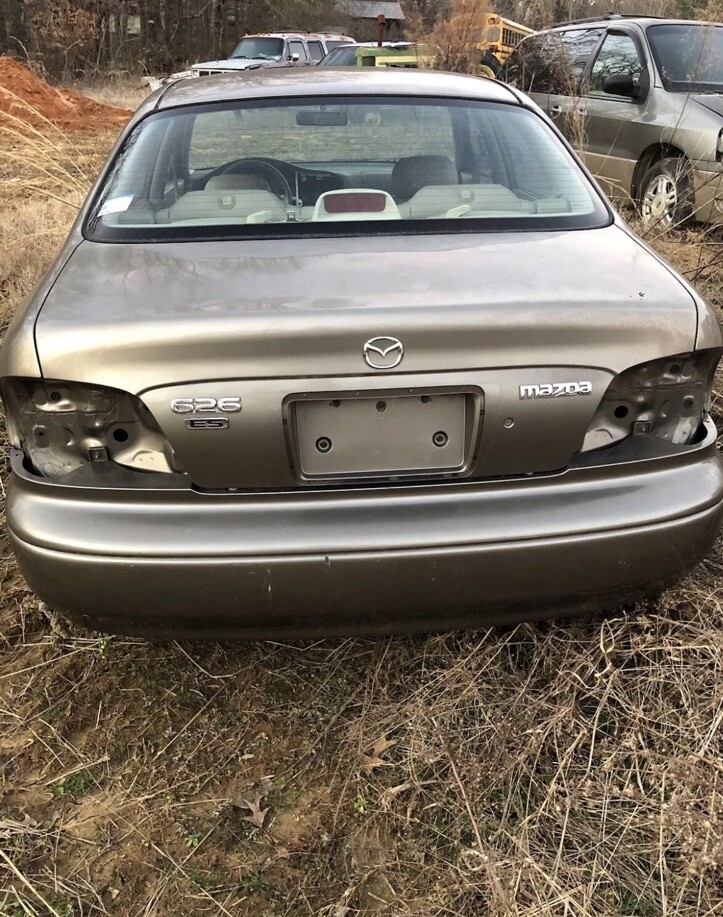 1998-2002 Mazda 626 Trunk Lid Trim License Plate Garnish GG2A