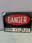 Vintage High Voltage metal sign.Appears to be a light coated porcelain.15”-11”.