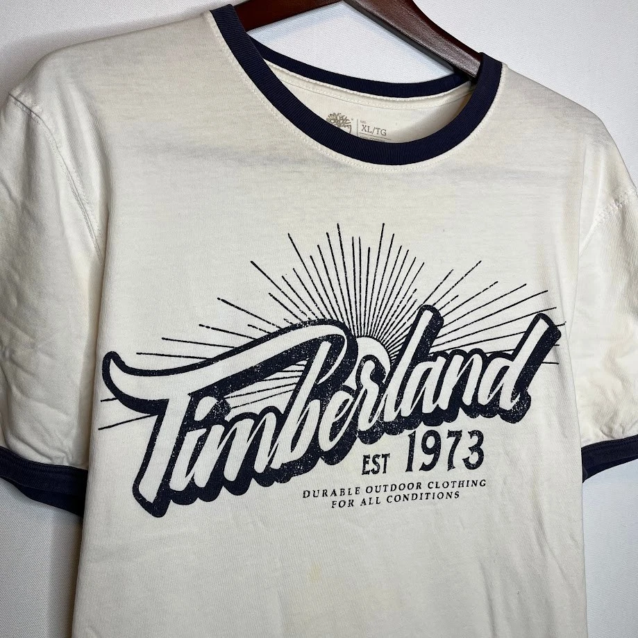 Camiseta Timberland Ringer masculina XL branca azul marinho acabamento logotipo gráfico 1973 - Imagem 2 de 4