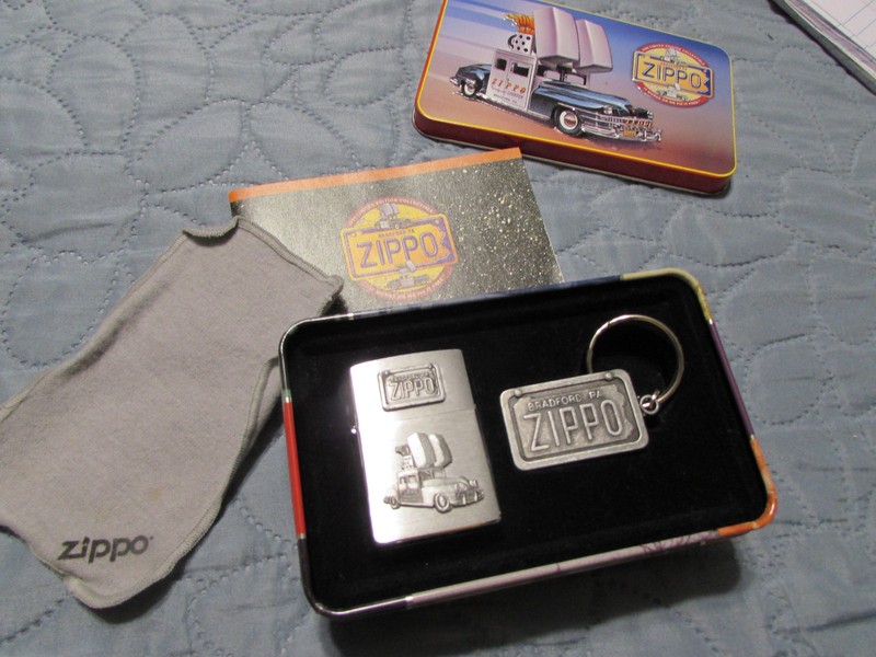 zippo lighter/ key chain 1998 with tin, new 