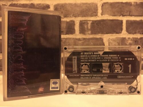 Bande cassette At Death's Door II suffocation sorcellerie immolation cynique (1993) - Photo 1/3
