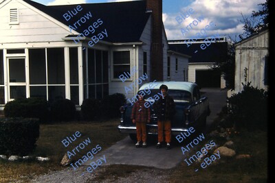 1958 35mm Slide Two Girls Sidewalk Roller Skates Car Driveway House Garage #5234