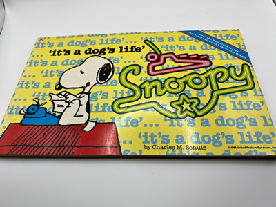 Snoopy It s a Dog s Life Comic Strip Softcover Book by Charles M. Schulz 1985