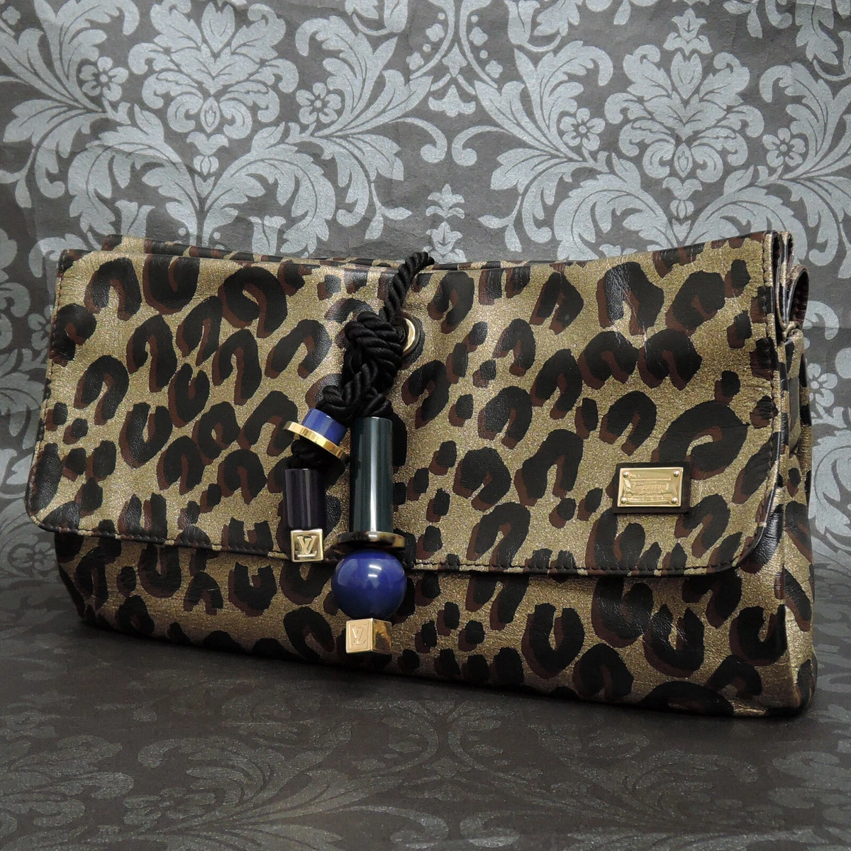 louis vuitton african queen clutch