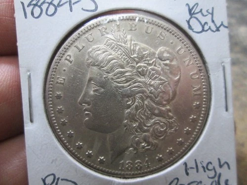 US 1884 S MORGAN DOLLAR COIN IN ABOUT UNCIRCULATED CONDITION
