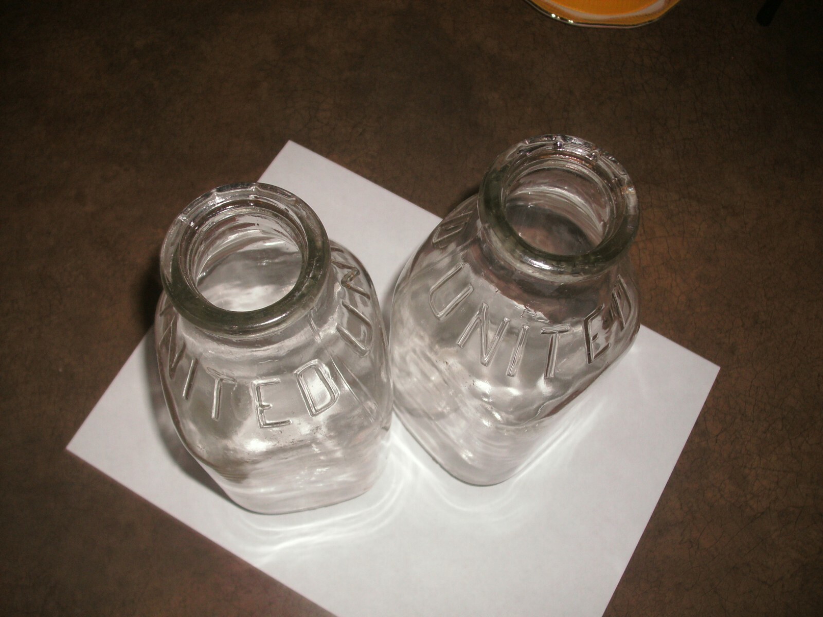 UNITED DAIRY CO. 1 QUART EMBOSSED MILK BOTTLE.