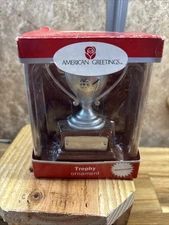 Collectible American greetings Christmas ornament in the shape of a trophy