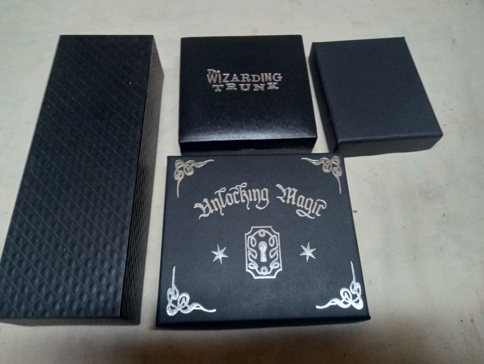 Harry Potter collectible lot, wizarding world trunk, pendant, keys, charms, more