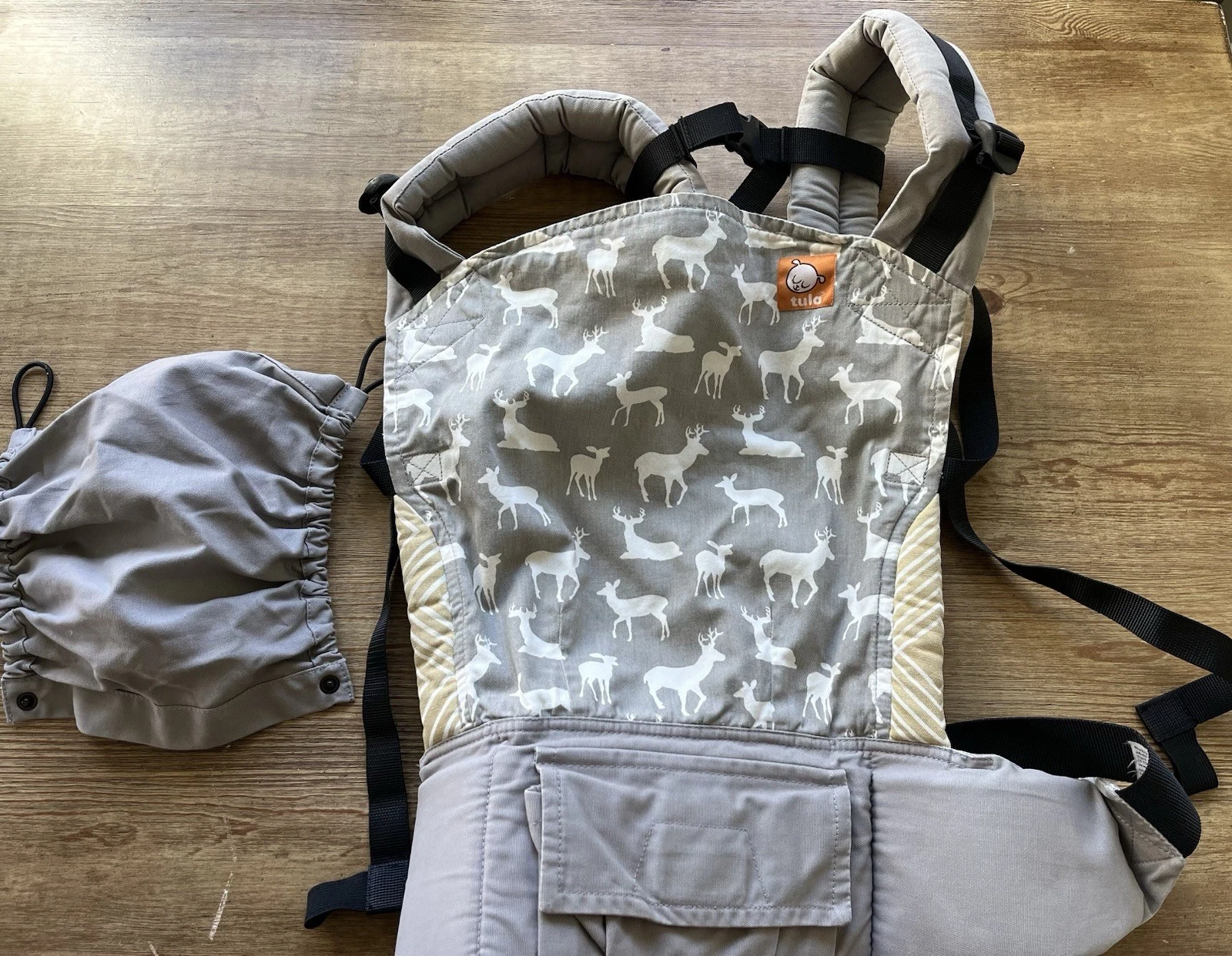 Tula baby carrier, deer print, with hood cover. Good used condition.