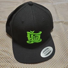 The Authentic Yupoong Snapback Classics Cap Black/Green logo front and back