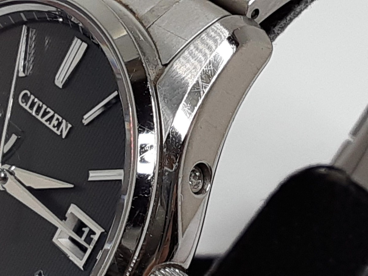 The Citizen Eco Drive Date Aq1020-51A A010-T018963 Ti Black Dial