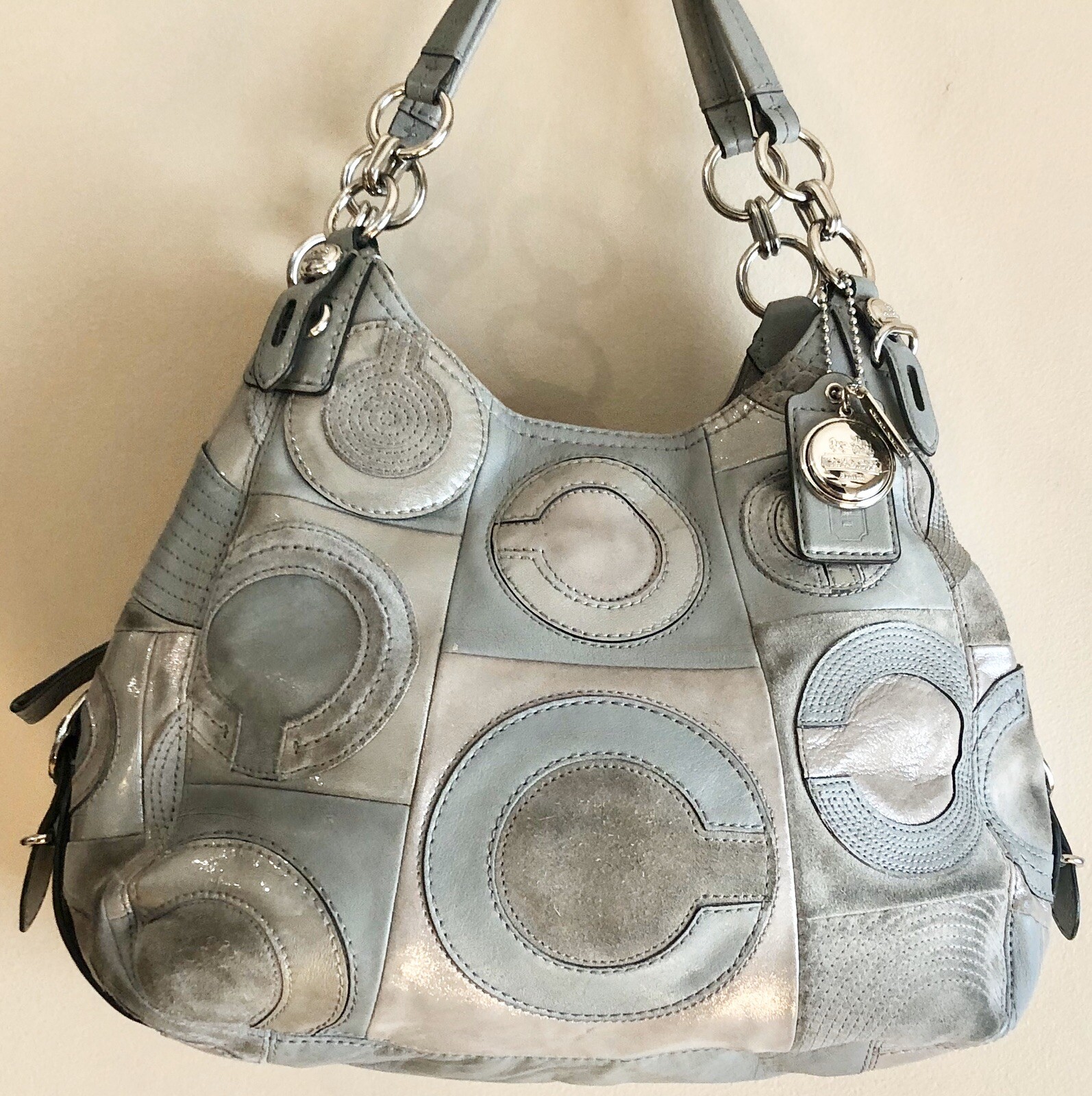 white coach purse with colored c's