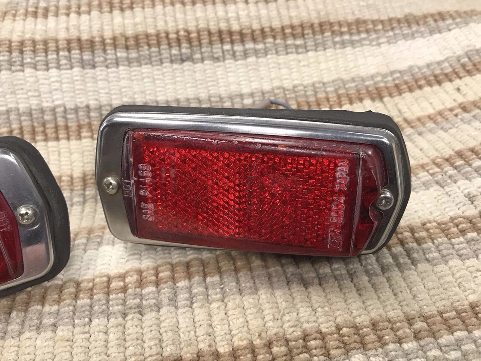 Par de luces marcadoras laterales traseras rojas Datsun OEM 240Z 260Z 280Z 1970-78 Foto 3 de 4