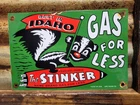 VINTAGE STINKER PORCELAIN SIGN 1953 IDAHO GAS FOR LESS SKUNK GASOLINE STATION