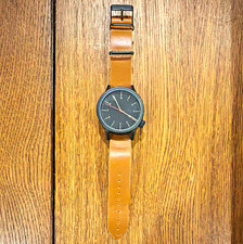 KOMONO Unisex Quartz Watch Black Dial Black Case Brown Leather Strap 43mm