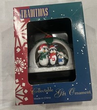 Vintage Westmar Traditions Ornament.  Three penguins in an igloo