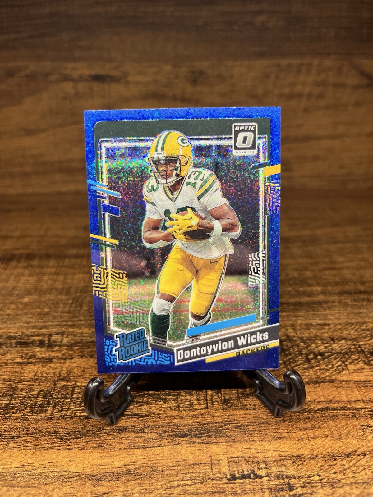 2023 Panini Donruss Optic Rated Rookie Blue Glitter Prizm #249 Dontayvion Wicks