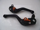 KTM 625 SMC, CNC levers set short black alloy with orange adjusters DB12/C31