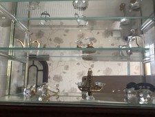 Wooden /glass display cabinet with assorted small crystal /glass pieces