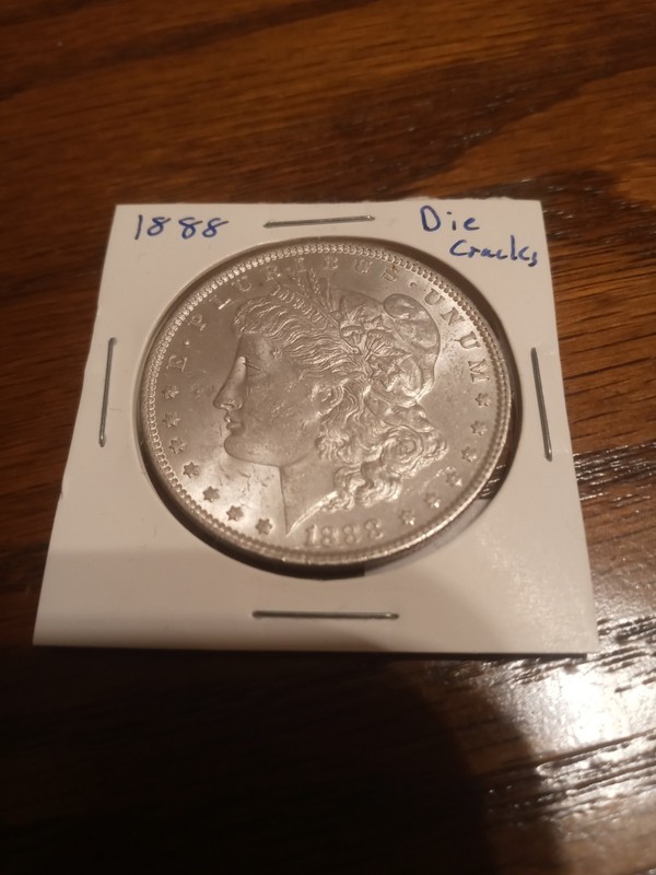 Great addition to your collection 1888 Morgan Dollar with die cracks in case