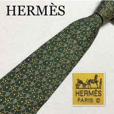 HERMES tie with hardware all over pattern 100 silk made in France green tones bu