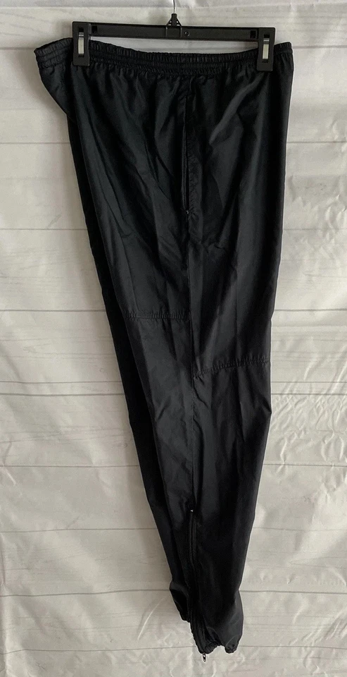 Pantalones de chándal Nike para hombre pequeños de nailon cortavientos con cremallera en el tobillo Swoosh bordados años 90 Foto 4 de 4