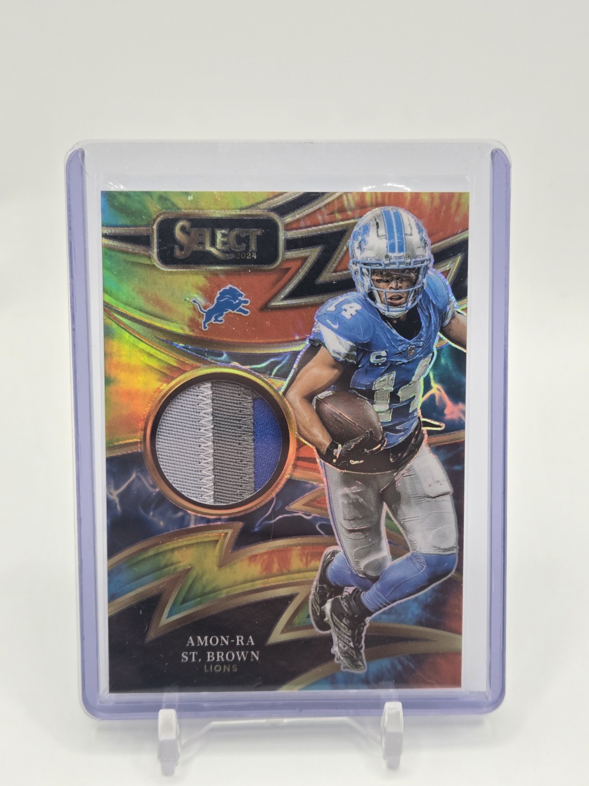 2024 Panini Select Amon-Ra St Brown Sparks Tie Dye Patch #/25 Detroit Lions