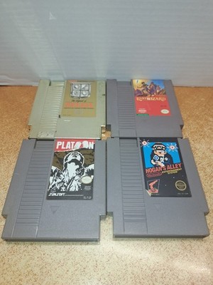 lot of 4 nes games zelda, legacy of the wizard, platoon hogans alley