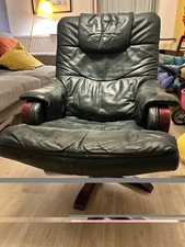 Black Leather Recliner Chair, Upholstered, Dark Wood Frame, Solid Pattern