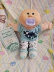BBB Cabbage Patch Kids  Baldblue/green Eyes- Purple Pacifier- Head Smeels Great