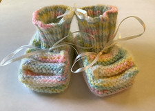 hand knit newborn booties in variegated baby colors 100 acrylic w/white ribbon