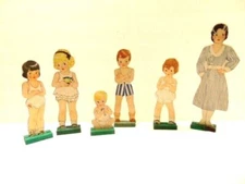 vintage cardboard fashion / dress-up dolls with about 12 pieces of paper clothes