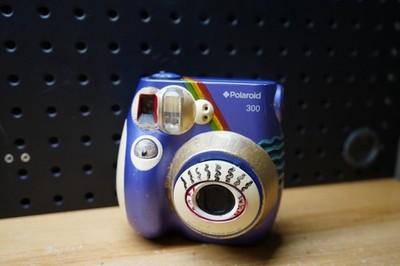 i) Polaroid 300 Instax Mini Instant Film Camera Purple Polaroid