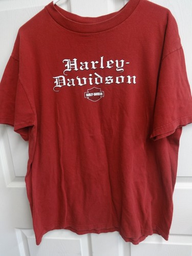 Red vintage T-shirt with white “Harley-Davidson” text and logo, men’s XL, USA made.