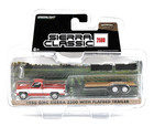 Greenlight 1986 GMC Sierra 2500 w/ Flatbed Trailer 1:64 Red/White
