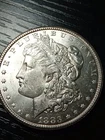 1883-CC BU silver Morgan dollar. Brilliant. Pretty. No reserve.
