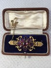 Victorian Pinchbeck Brooch with purple stones & box